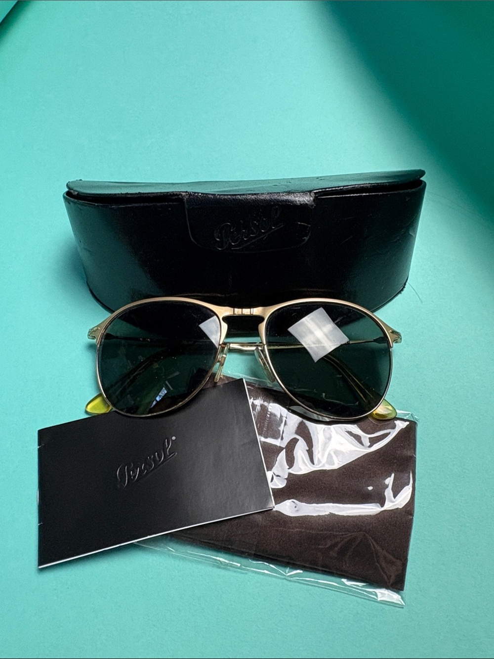 Persol Gold Frame Sunglasses with Dark Green Lenses and Black Case